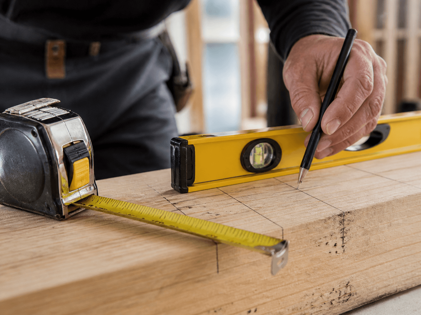Contractor measuring carefully — ongoing maintenance done right.